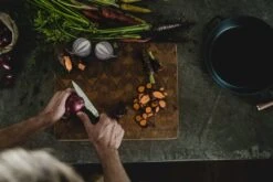 Fiskars Norden Paring Knife -Selected Kitchenware Store Fiskars Norden Paring knife cutting onion Hero image 1026424